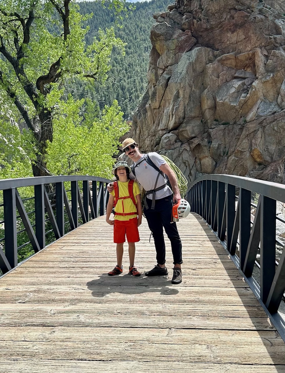 Climbing guide, Clay and his student smiling after a day on the mountain